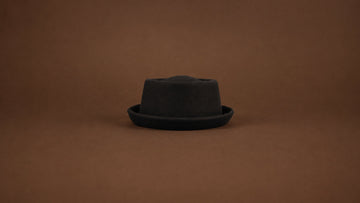 The bound Gemvie pork pie hat, shown in a complete silhouette.